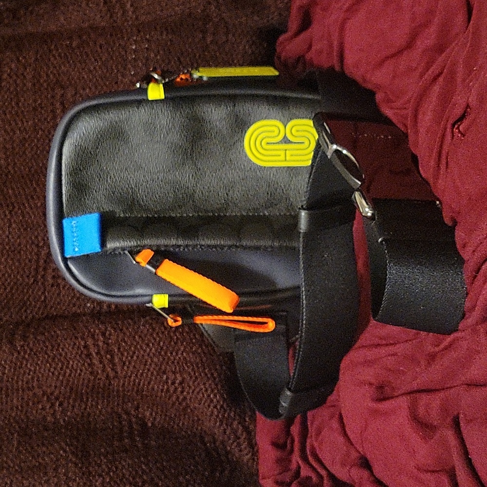 Coach mini crossbody bag with neon accents